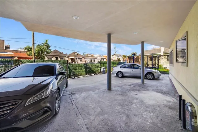 a view of a terrace with a table and chairs