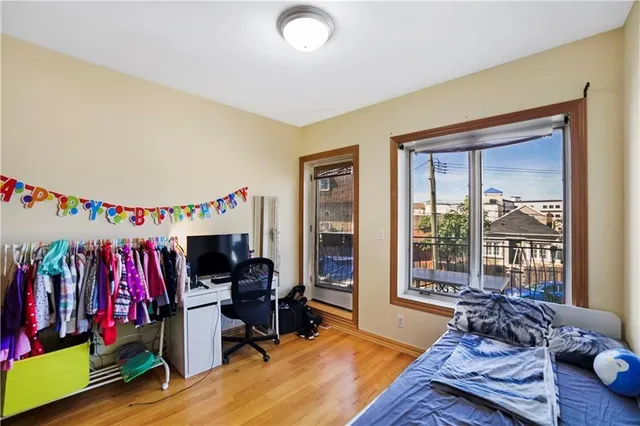 a bed room with a bed and a window