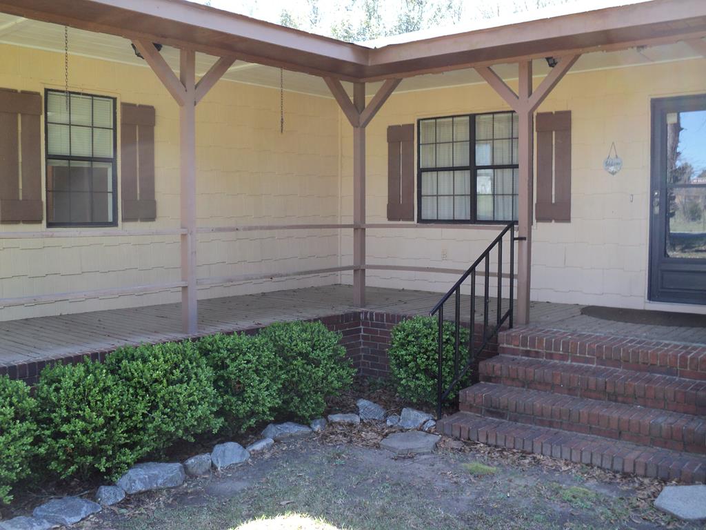 74 Kitetown Loop Seale, AL 36875 - Photo 17 of 28 a view of a house with a small yard and plants