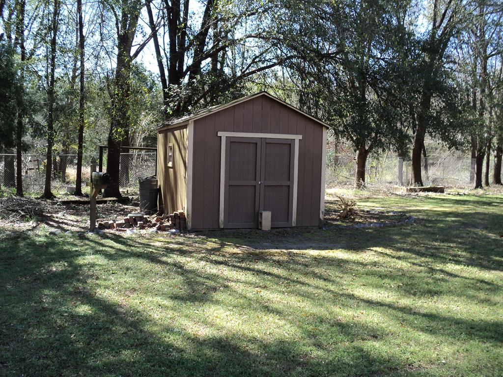 74 Kitetown Loop Seale, AL 36875 - Photo 21 of 28 a view of a house with yard and garage