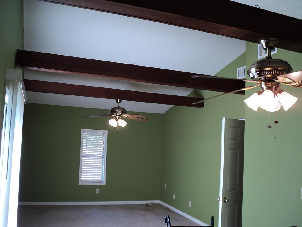 74 Kitetown Loop Seale, AL 36875 - Photo 3 of 28 a front door view of a livingroom with a chandelier fan and a window