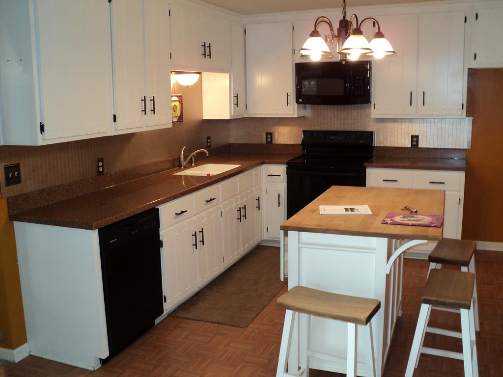 74 Kitetown Loop Seale, AL 36875 - Photo 4 of 28 a kitchen that has a lot of cabinets in it with granite countertop stainless steel appliances
