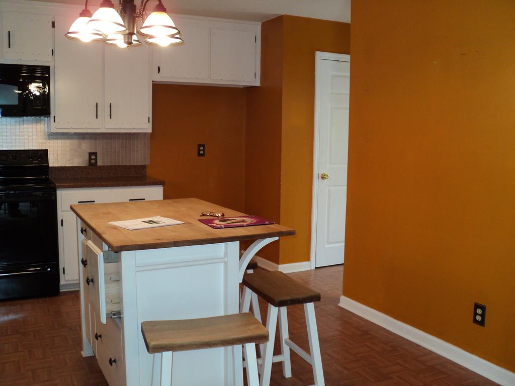 74 Kitetown Loop Seale, AL 36875 - Photo 6 of 28 a kitchen with a sink a stove cabinets and wooden floor