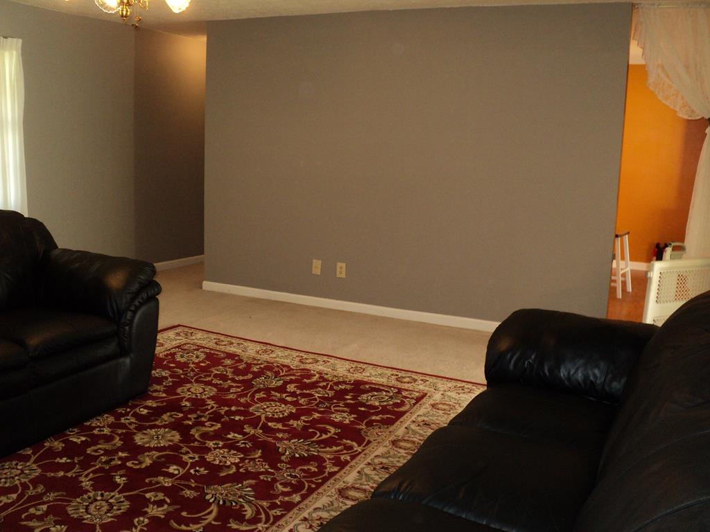 74 Kitetown Loop Seale, AL 36875 - Photo 10 of 28 a bed sitting in a bedroom next to a window