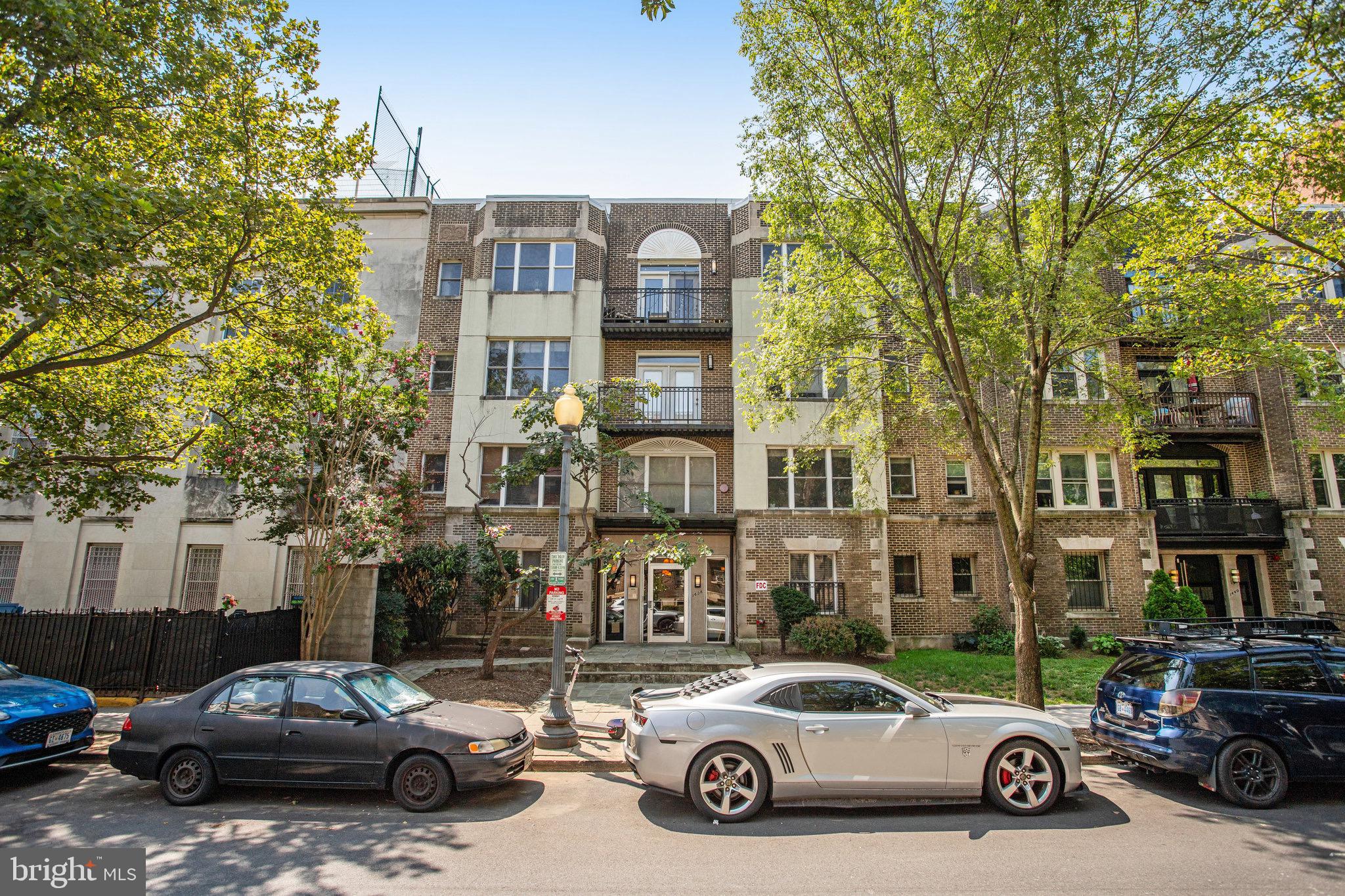 1438 Columbia Road Northwest, Unit 101 Washington, DC 20009 - Photo 29 of 39 a car parked in front of a building