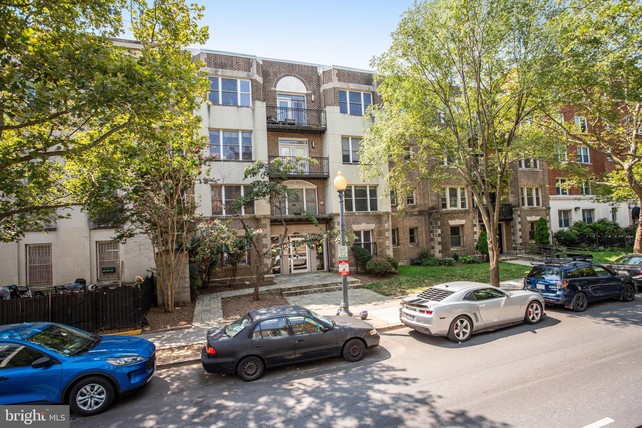 1438 Columbia Road Northwest, Unit 101 Washington, DC 20009 - Photo 30 of 39 a cars parked in front of a building