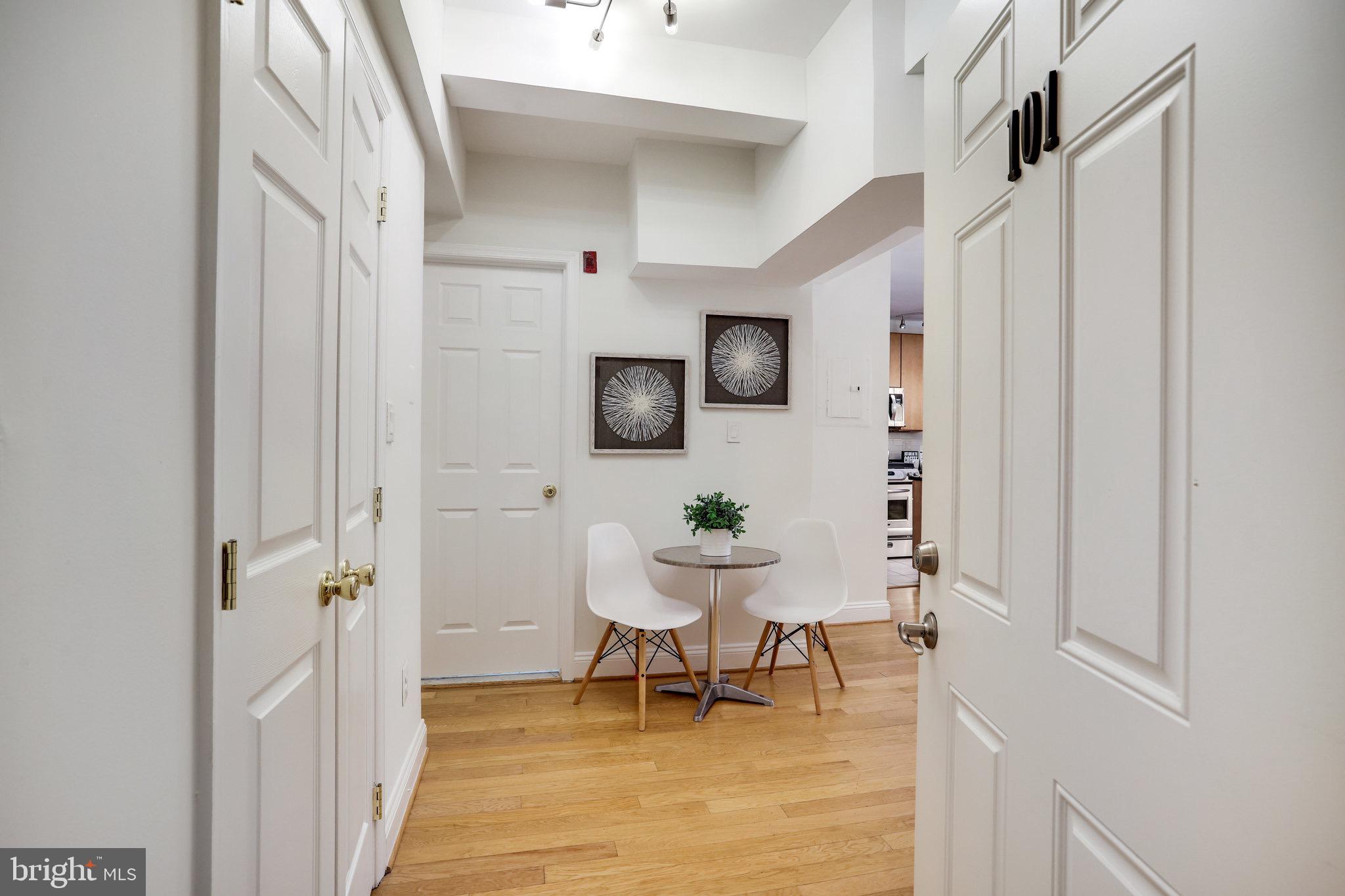 1438 Columbia Road Northwest, Unit 101 Washington, DC 20009 - Photo 4 of 39 a living room with furniture and a chair