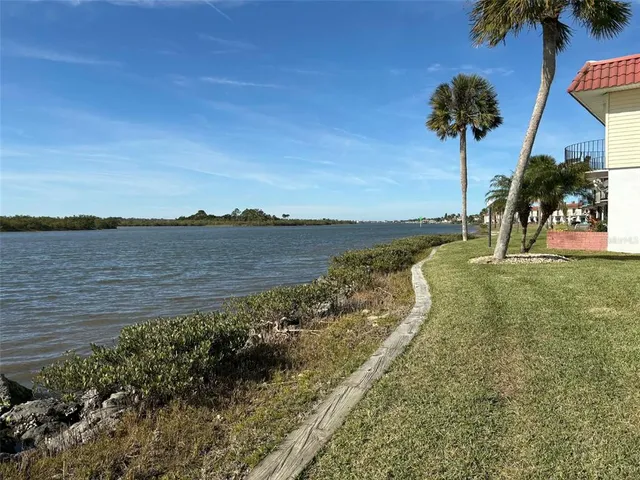 a view of a lake with a yard