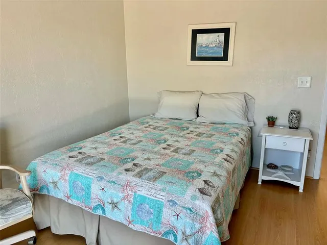 a bedroom with a bed and a dresser