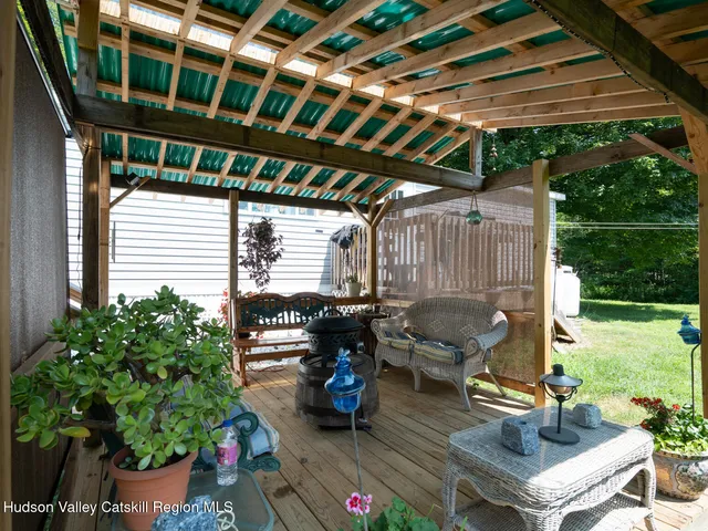 a view of a house with backyard sitting area and garden