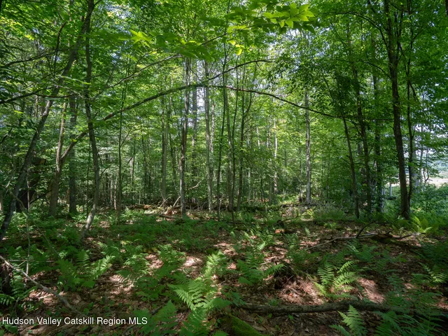 a view of house with a sign of a park