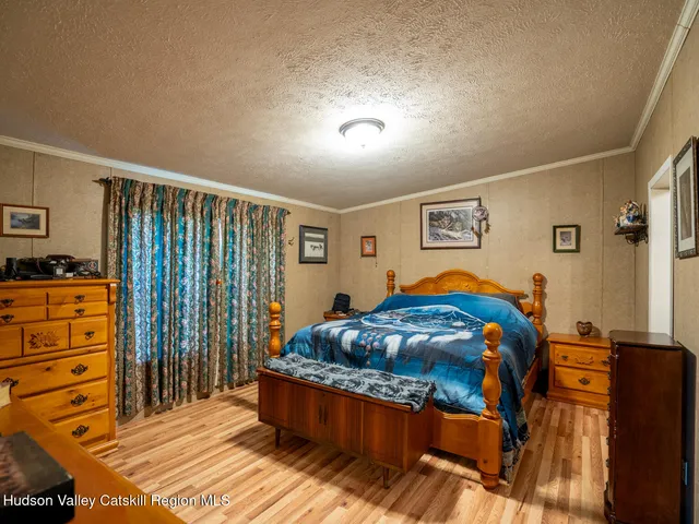 a bed room with bed and a window