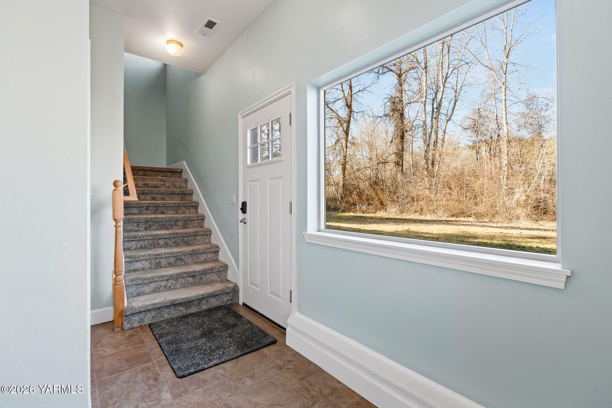1575 Nile Road Naches, WA 98937 - Photo 9 of 51 a view of a room with wooden floor and windows