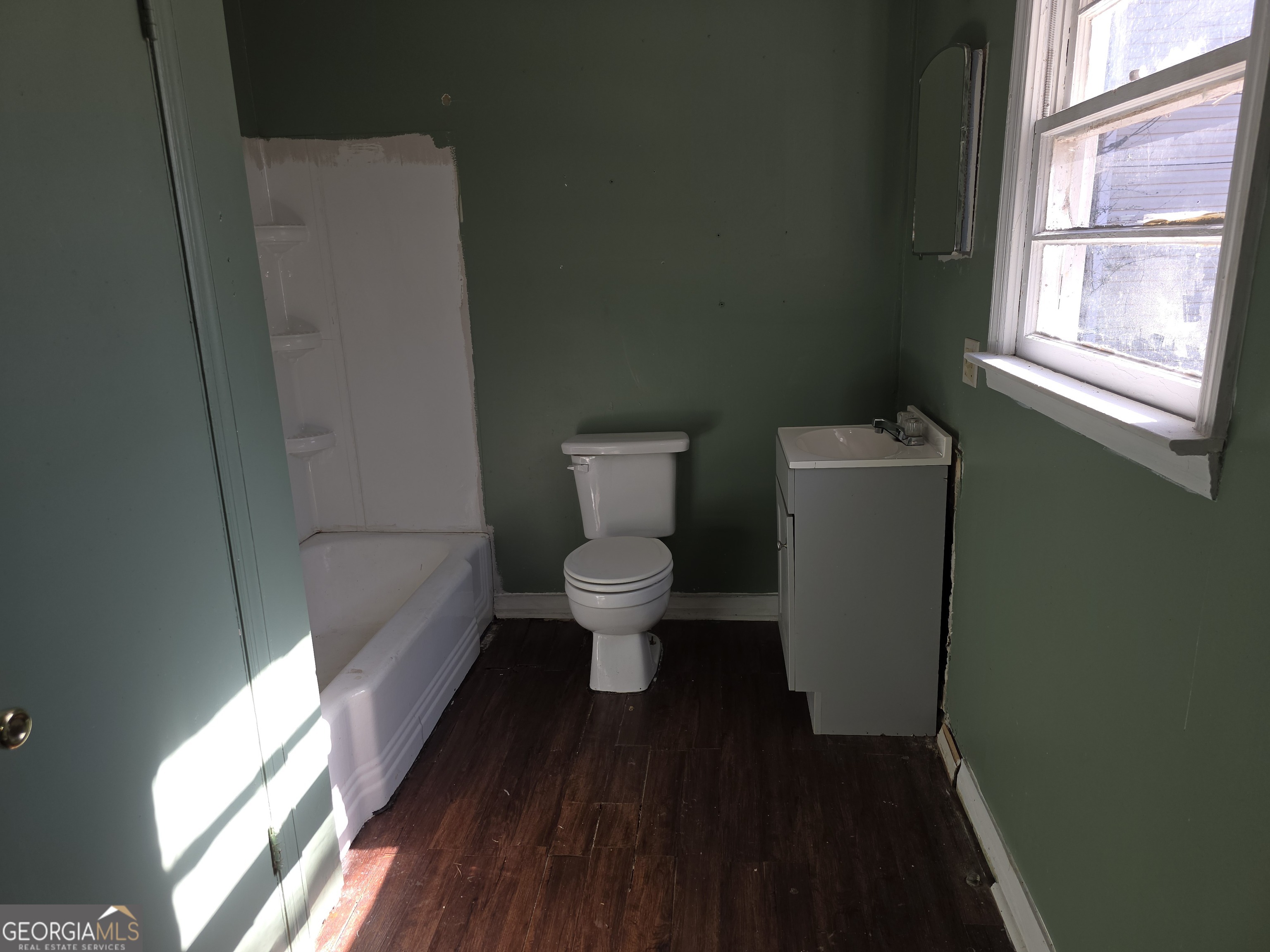 352 Harrison Road Tallapoosa, GA 30176 - Photo 12 of 12 a bathroom with a toilet and a window