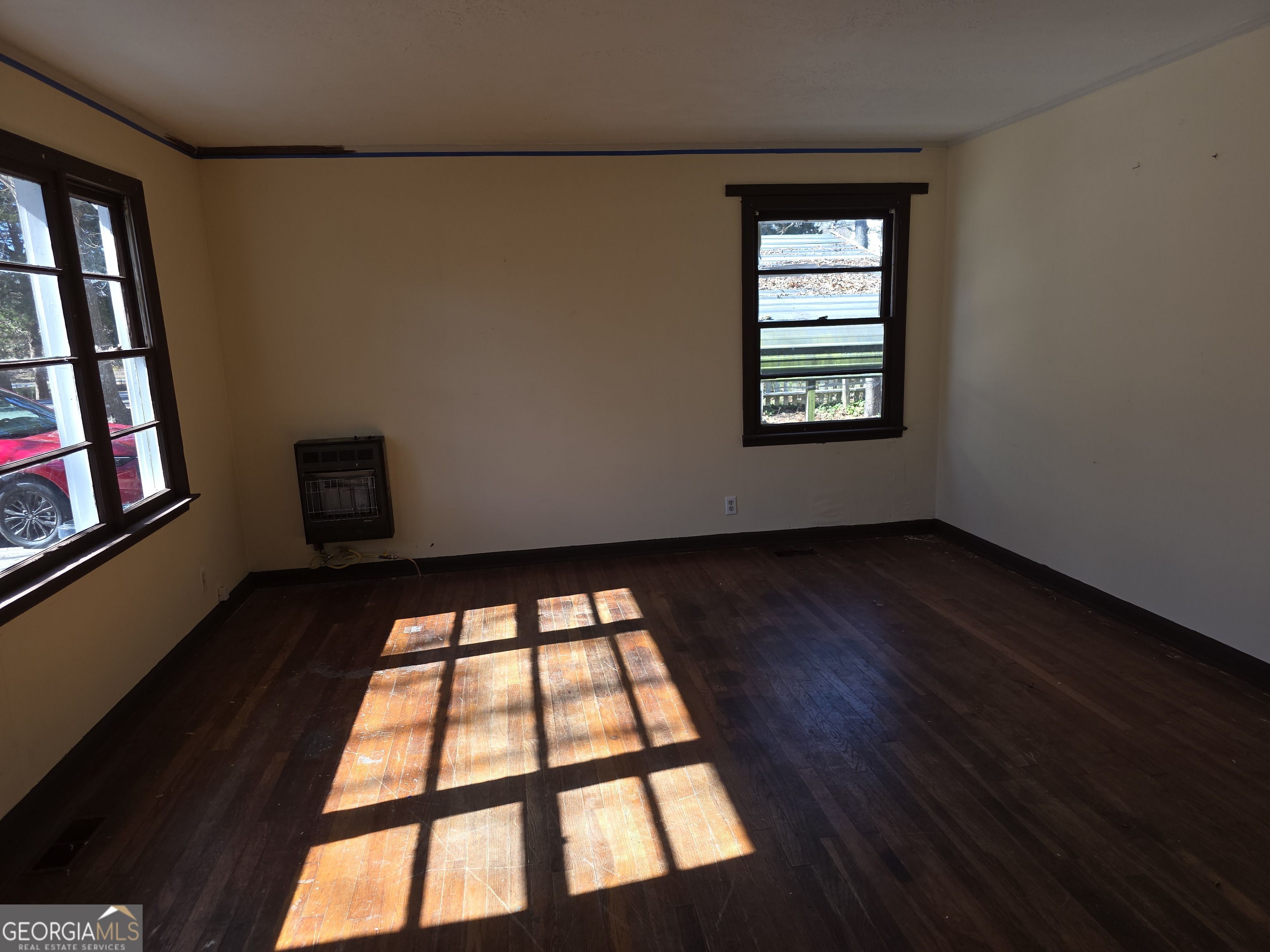 352 Harrison Road Tallapoosa, GA 30176 - Photo 2 of 12 wooden floor in an empty room with a window