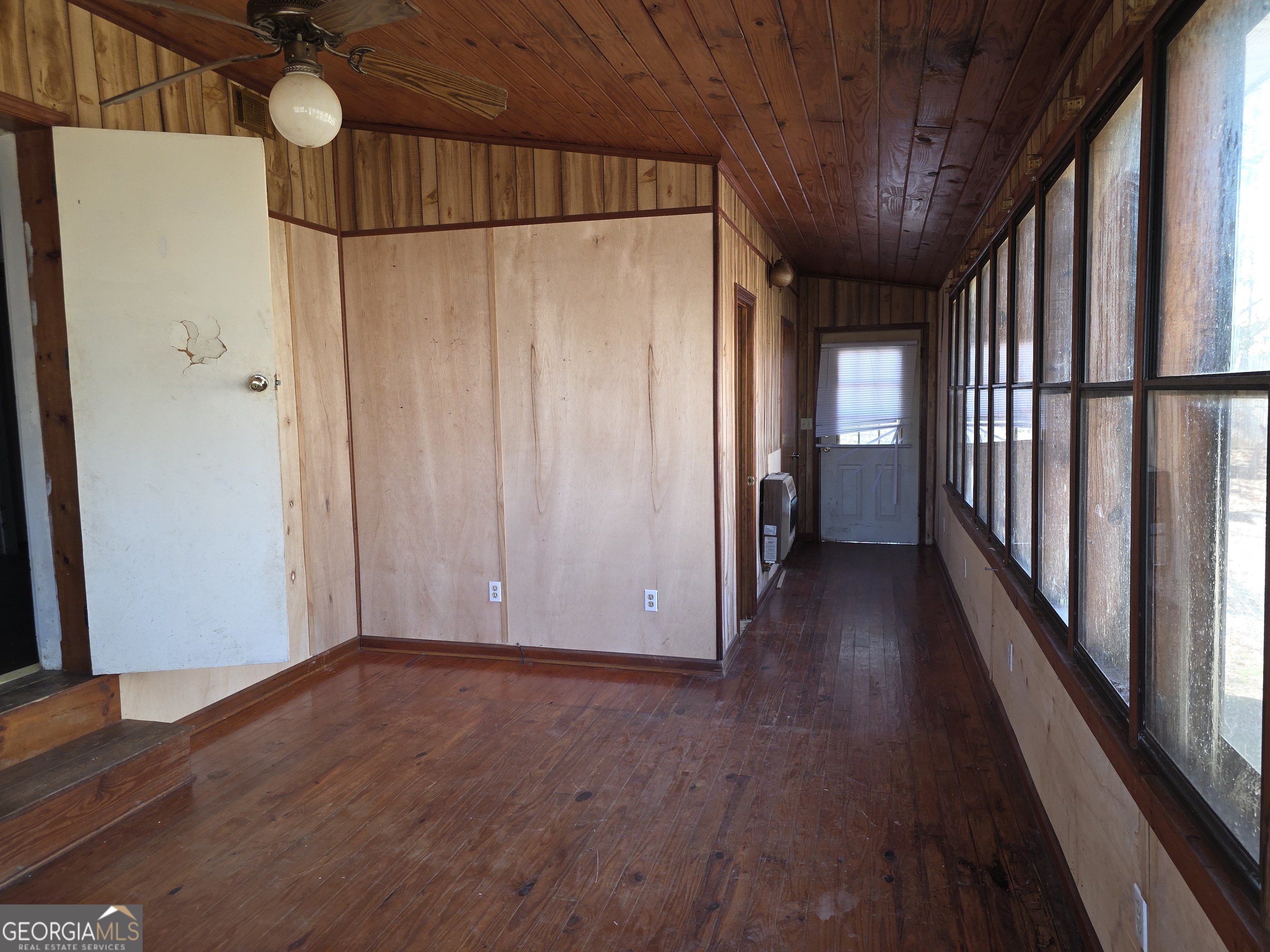 352 Harrison Road Tallapoosa, GA 30176 - Photo 5 of 12 a view of a hallway with wooden floor and staircase