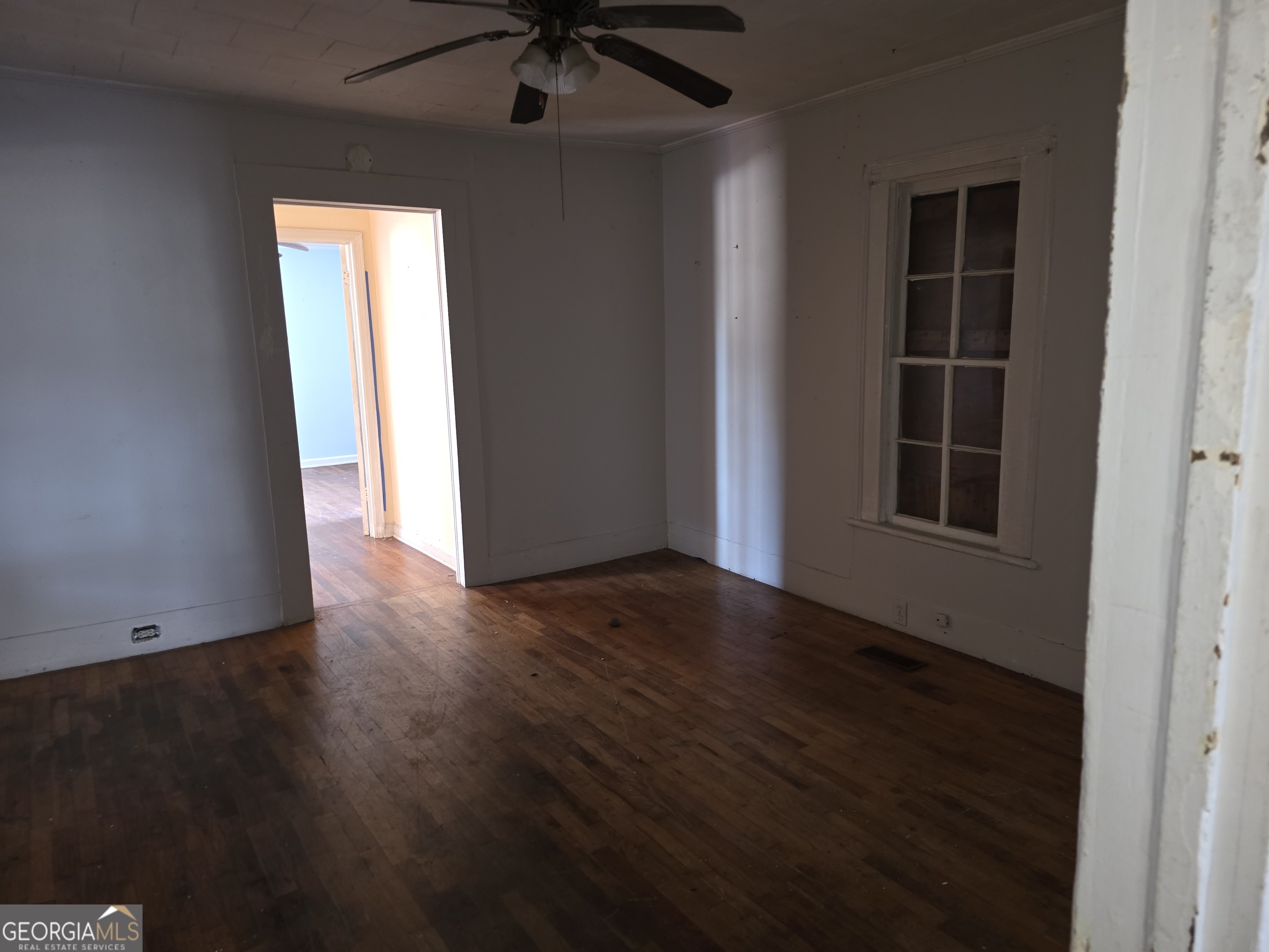 352 Harrison Road Tallapoosa, GA 30176 - Photo 10 of 12 an empty room with wooden floor and windows