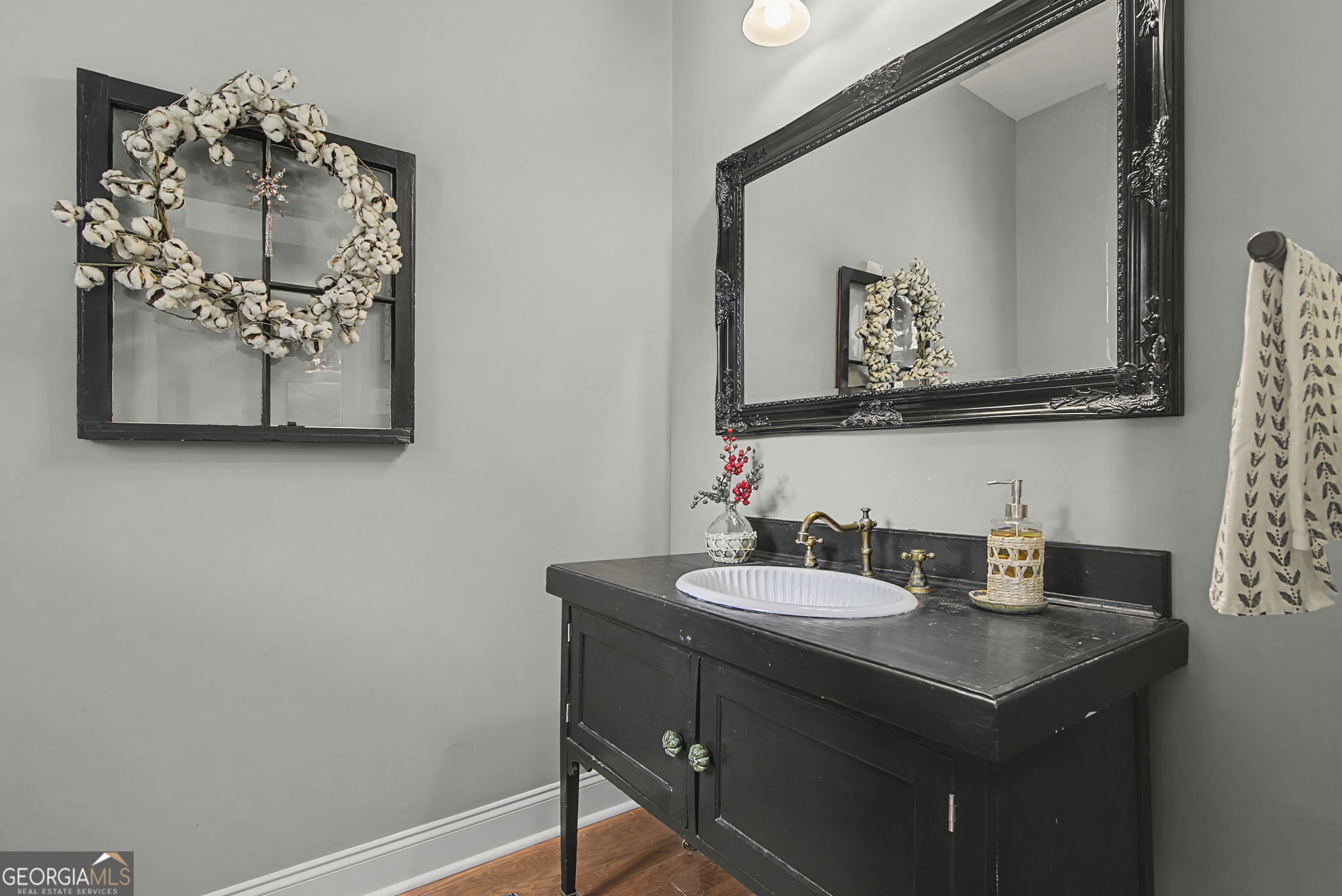 7 Harris Court Newnan, GA 30263 - Photo 26 of 64 a bathroom with a sink and a mirror