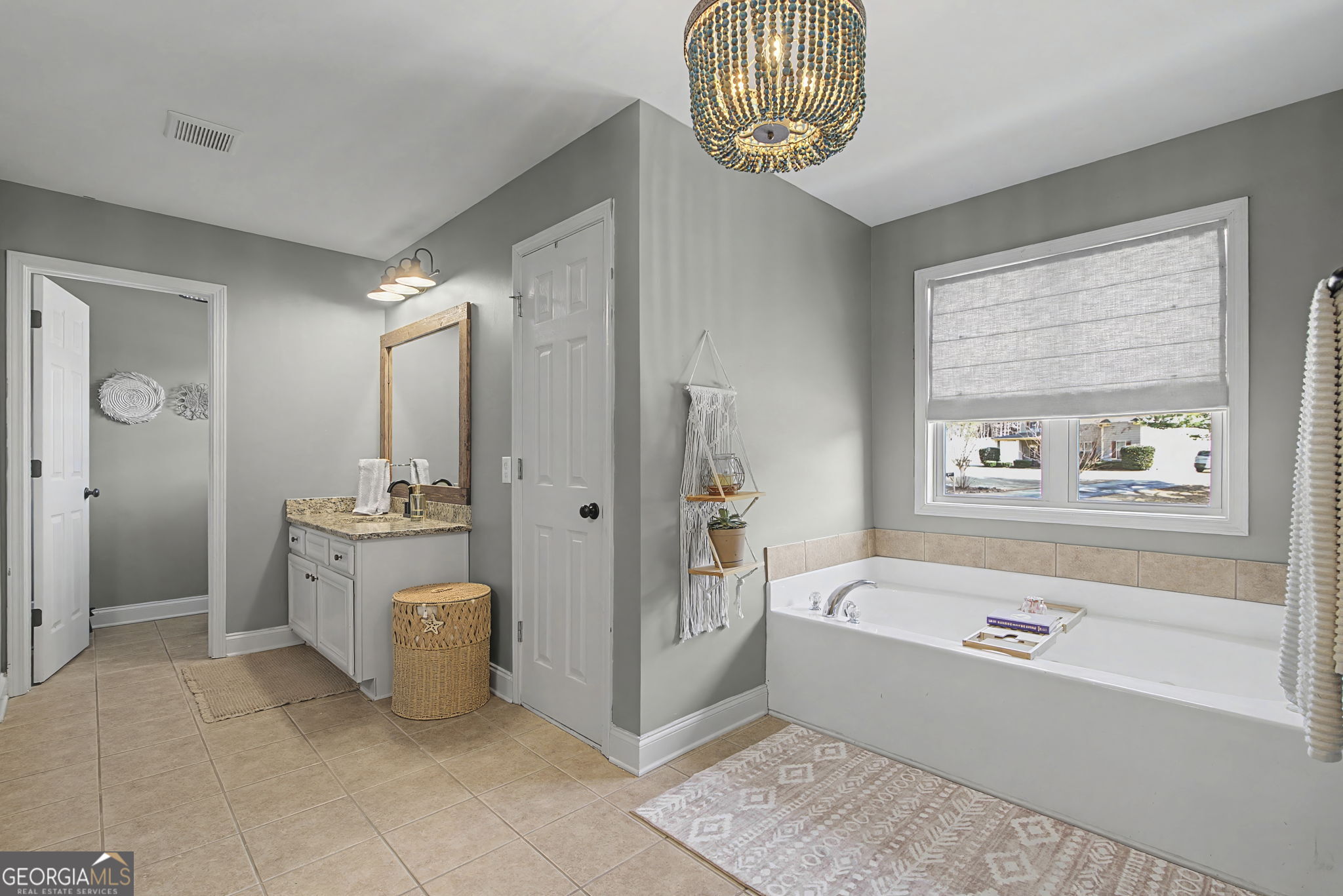 7 Harris Court Newnan, GA 30263 - Photo 29 of 64 a bathroom with a tub sink and mirror