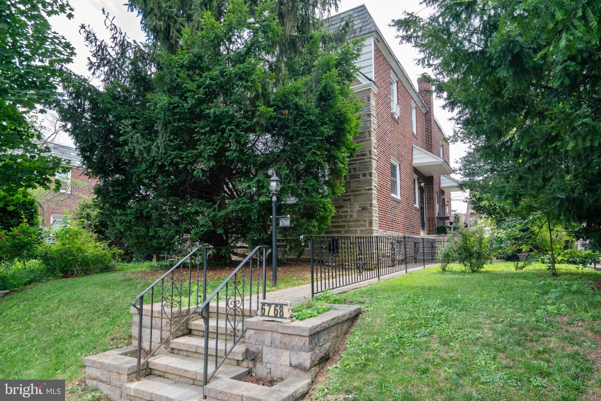 6768 Stenton Avenue Philadelphia, PA 19119 - Photo 13 of 76 a view of a chair and table in the yard