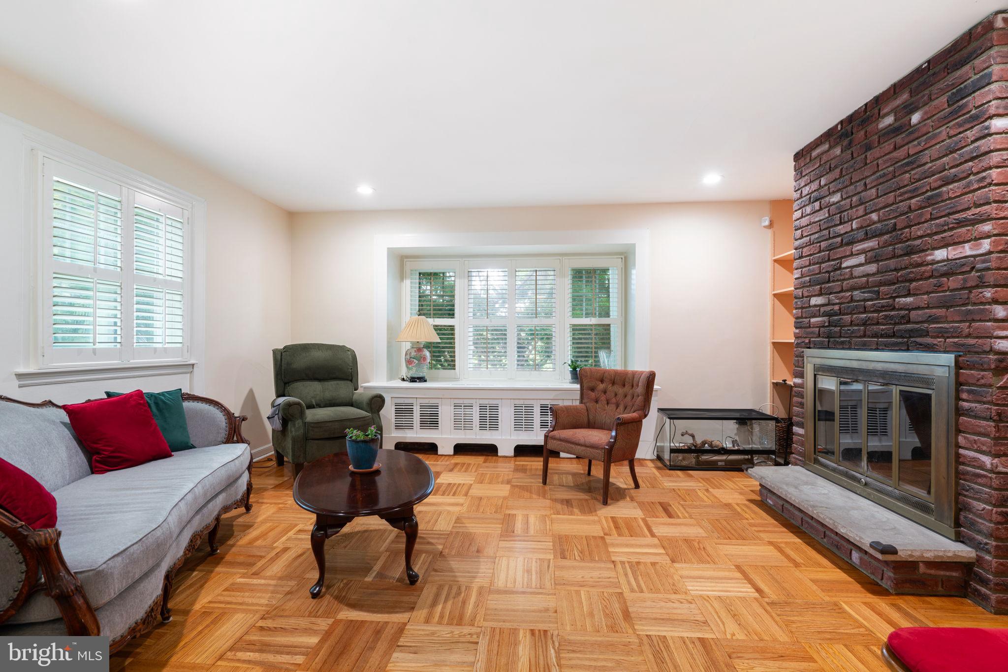6768 Stenton Avenue Philadelphia, PA 19119 - Photo 16 of 76 a living room with furniture fireplace and window