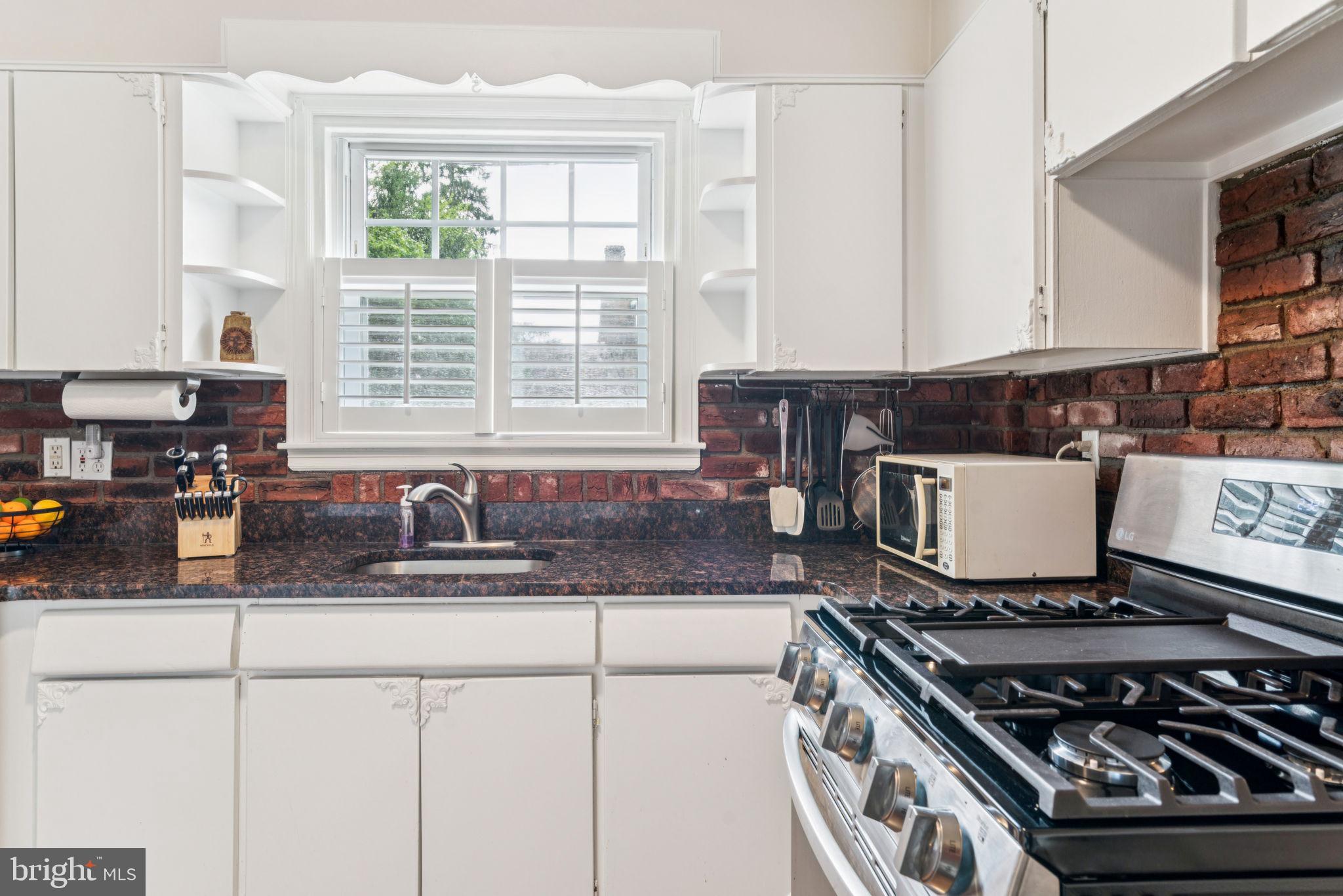 6768 Stenton Avenue Philadelphia, PA 19119 - Photo 21 of 76 a kitchen with a stove and a sink