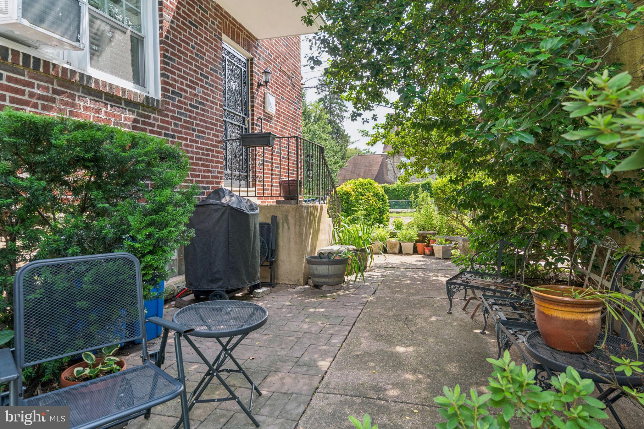 6768 Stenton Avenue Philadelphia, PA 19119 - Photo 26 of 76 a view of a backyard with chair and tables