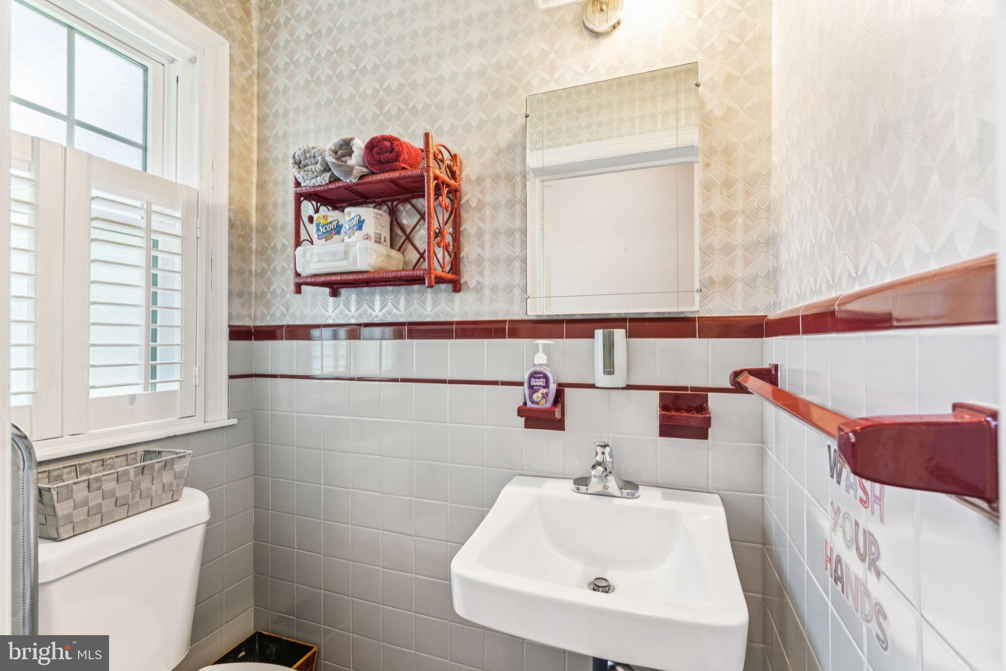 6768 Stenton Avenue Philadelphia, PA 19119 - Photo 33 of 76 a bathroom with a sink and a mirror