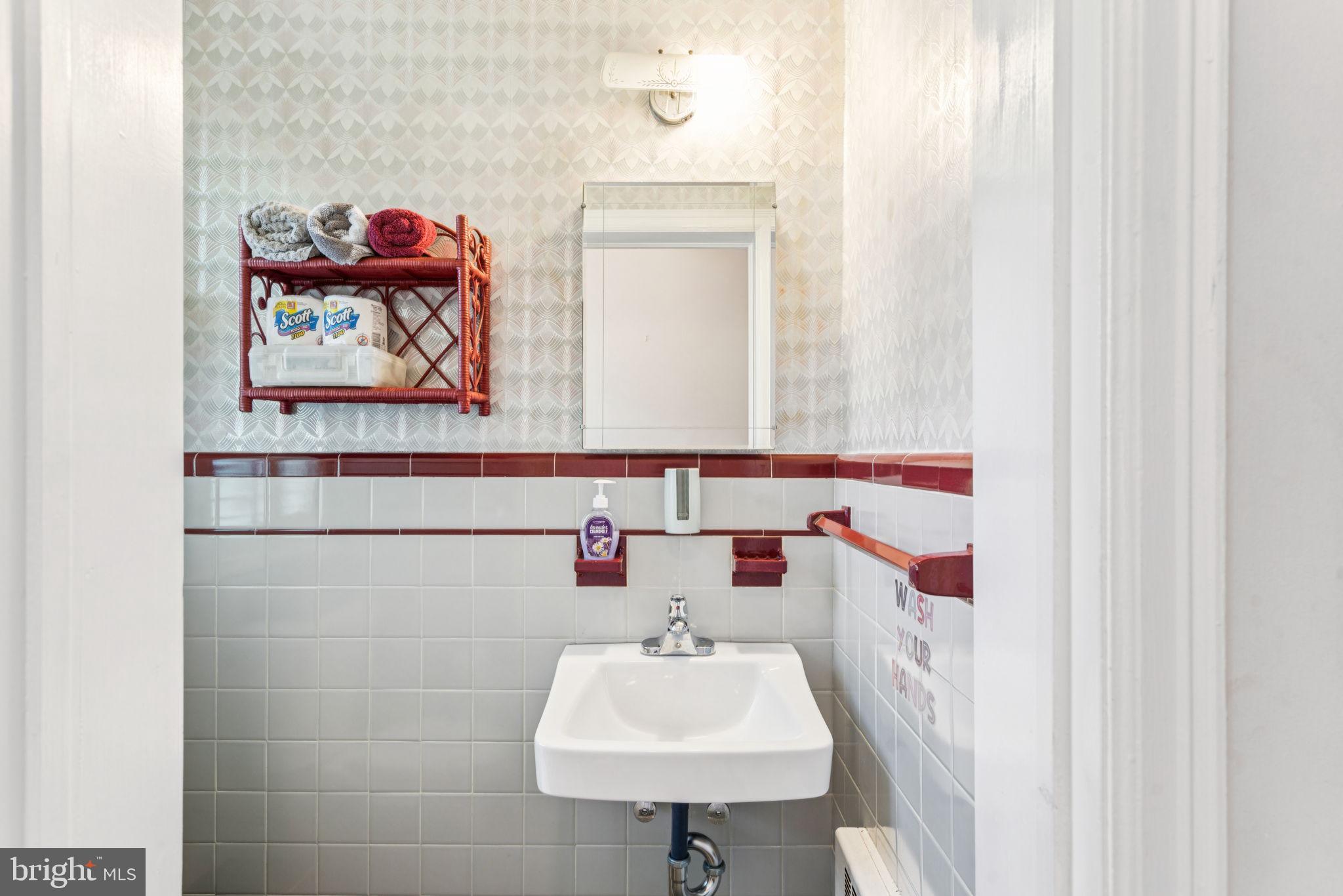 6768 Stenton Avenue Philadelphia, PA 19119 - Photo 37 of 76 a bathroom with a sink and a mirror