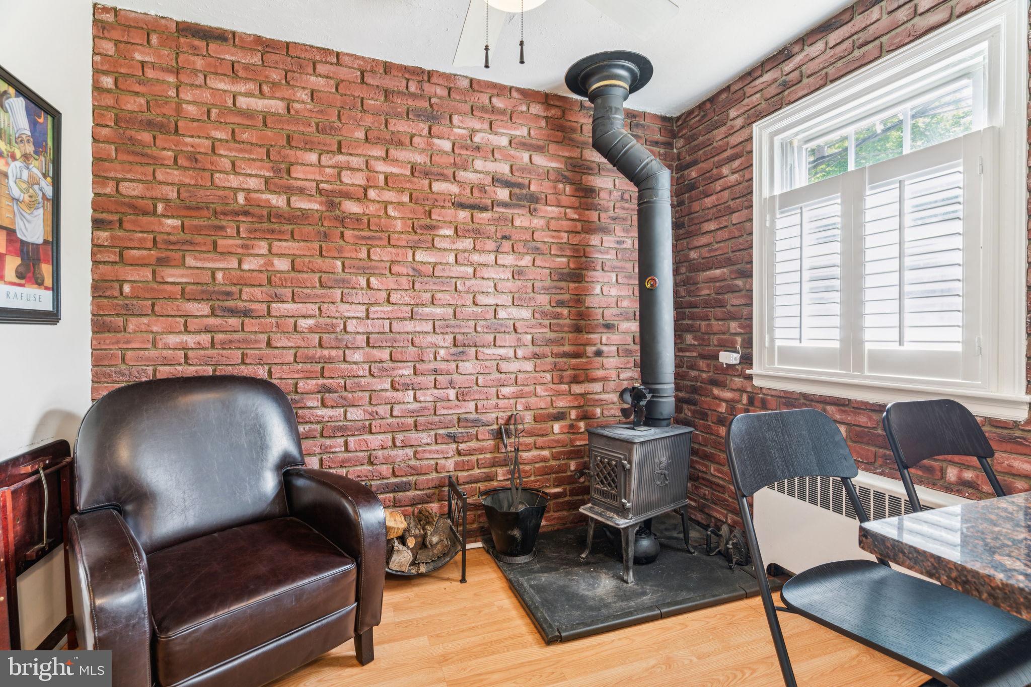 6768 Stenton Avenue Philadelphia, PA 19119 - Photo 39 of 76 a living room with furniture and a fireplace