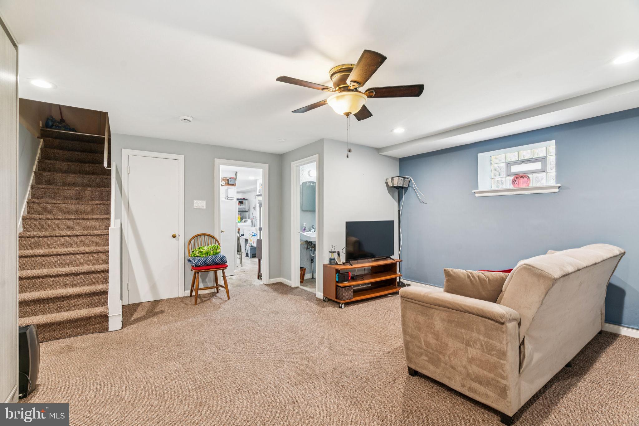 6768 Stenton Avenue Philadelphia, PA 19119 - Photo 41 of 76 a living room with furniture and a flat screen tv