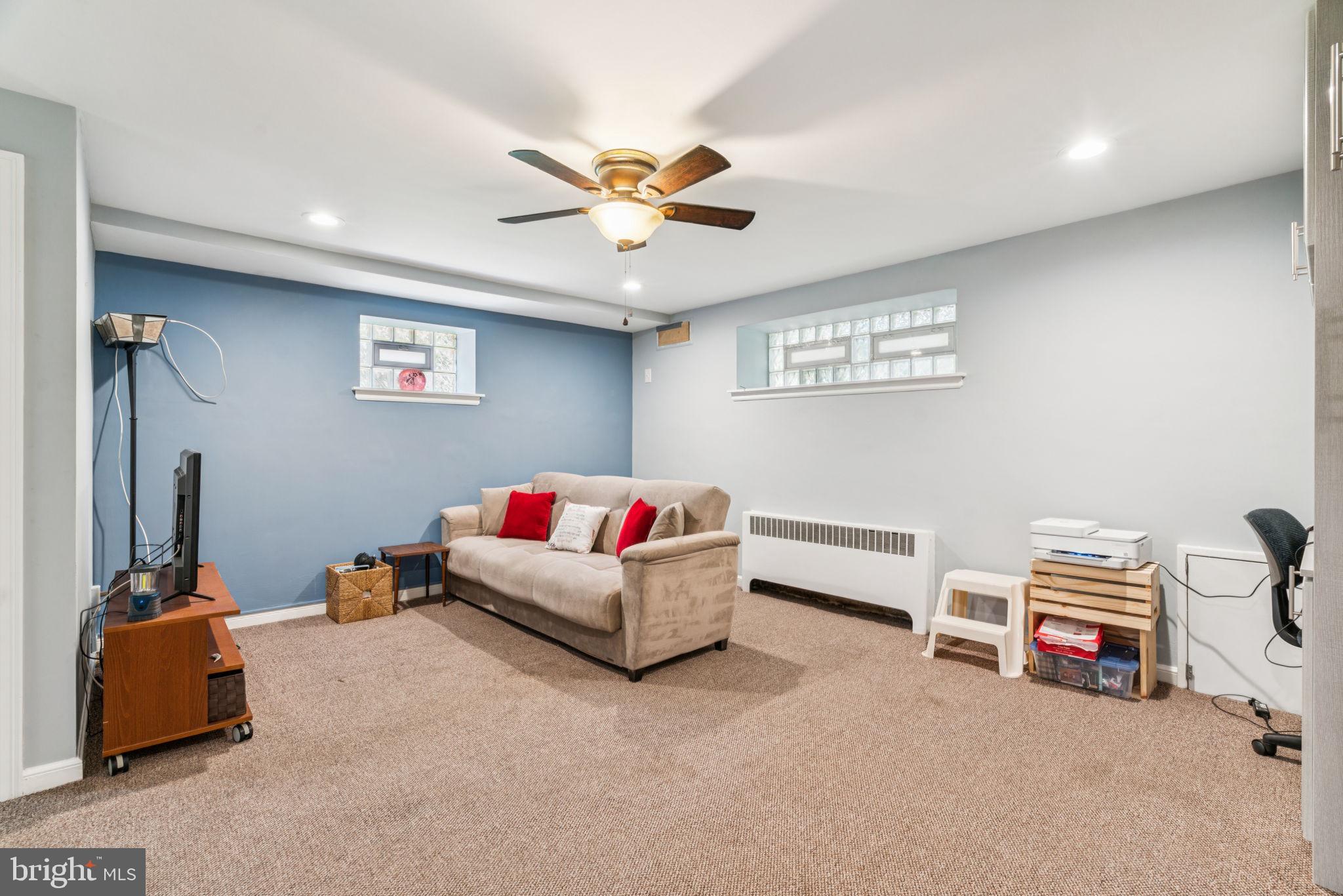 6768 Stenton Avenue Philadelphia, PA 19119 - Photo 42 of 76 a living room with furniture and a ceiling fan