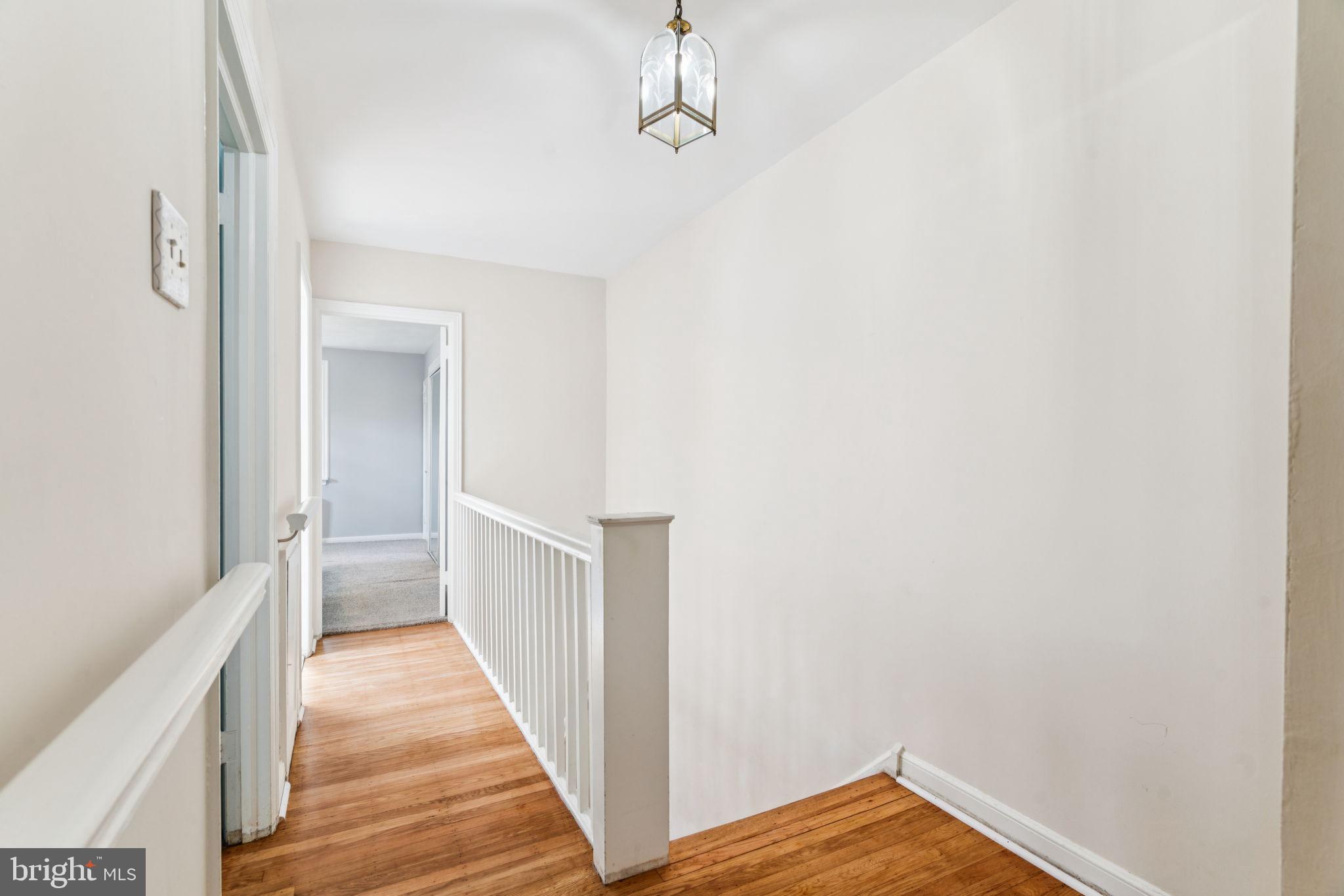 6768 Stenton Avenue Philadelphia, PA 19119 - Photo 49 of 76 a view of a hallway with wooden floor