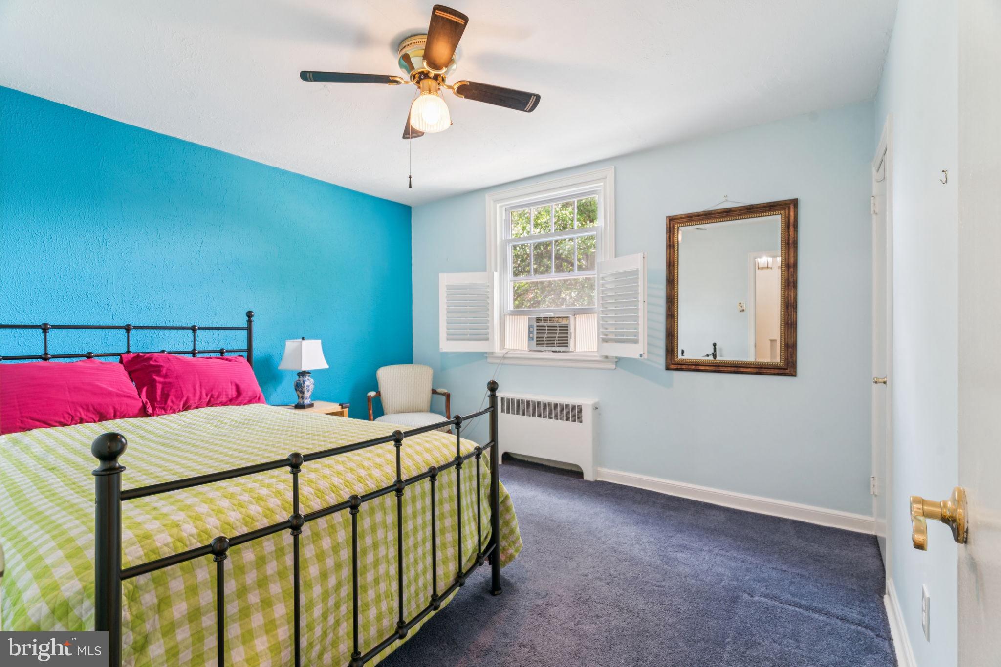 6768 Stenton Avenue Philadelphia, PA 19119 - Photo 51 of 76 a bedroom with a bed and a chandelier