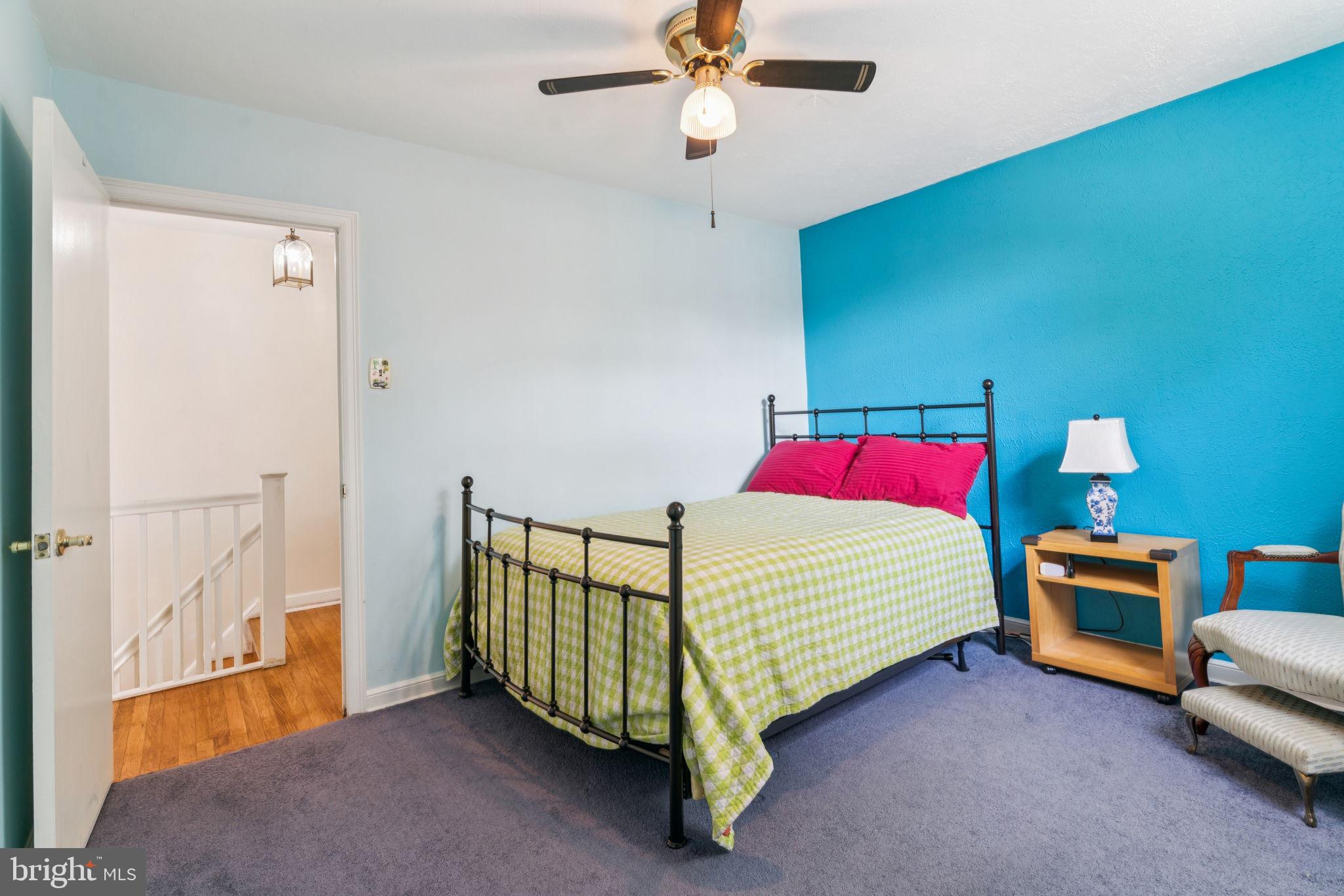 6768 Stenton Avenue Philadelphia, PA 19119 - Photo 52 of 76 a bed room with a bed and a chandelier