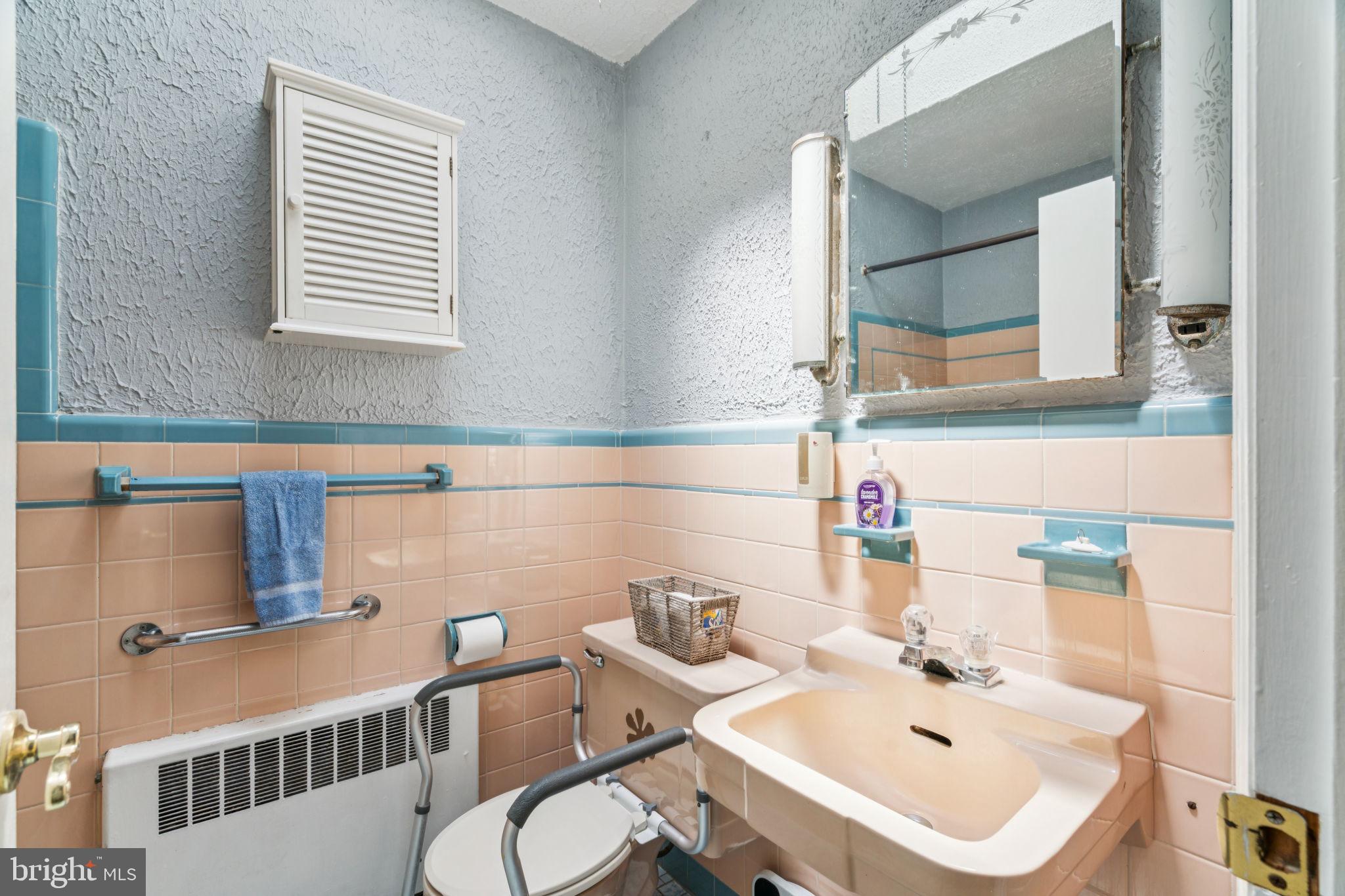 6768 Stenton Avenue Philadelphia, PA 19119 - Photo 54 of 76 a bathroom with a sink and a mirror