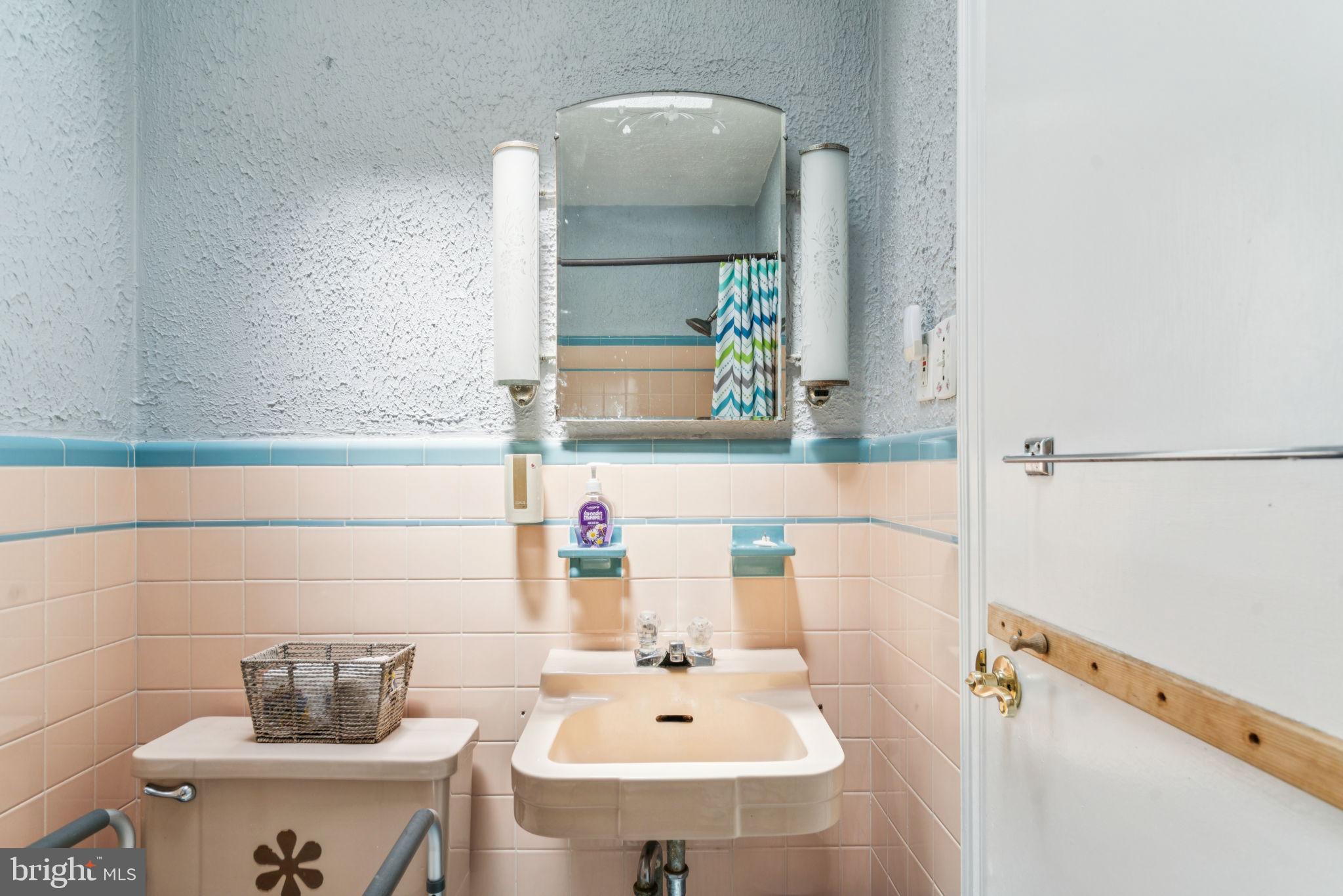 6768 Stenton Avenue Philadelphia, PA 19119 - Photo 55 of 76 a bathroom with a sink and a mirror