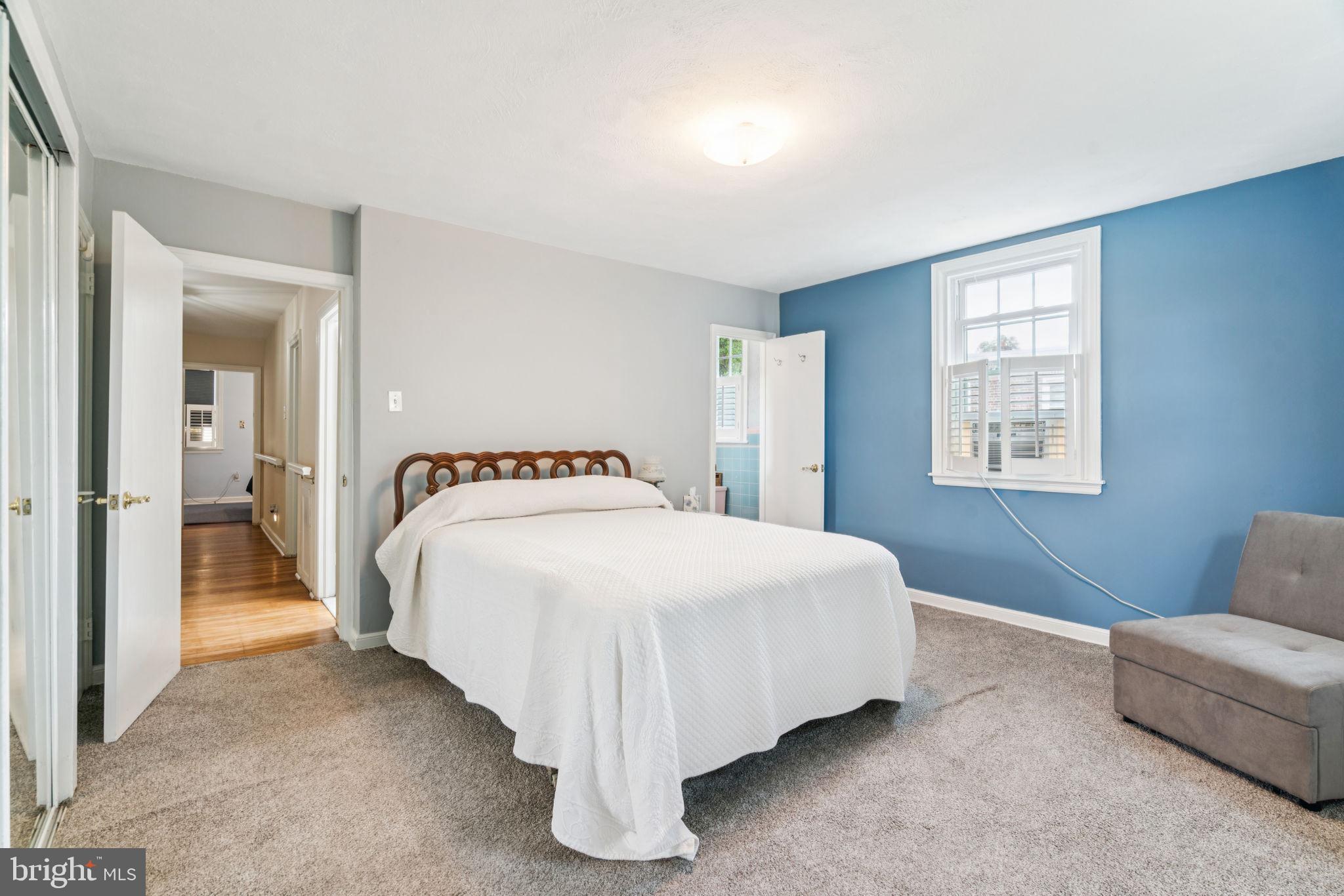 6768 Stenton Avenue Philadelphia, PA 19119 - Photo 59 of 76 a spacious bedroom with a bed and a couch