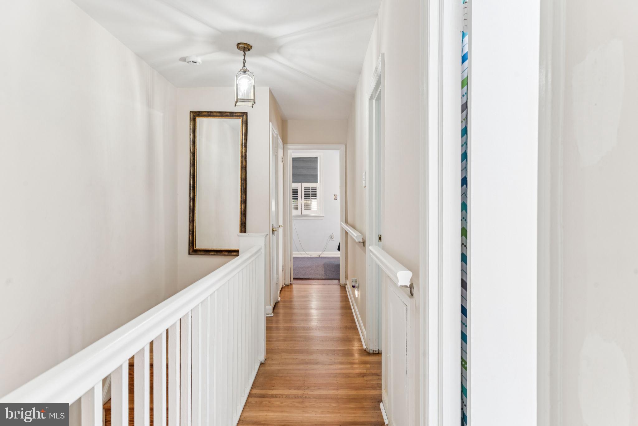 6768 Stenton Avenue Philadelphia, PA 19119 - Photo 66 of 76 a view of a hallway with wooden floor and staircase