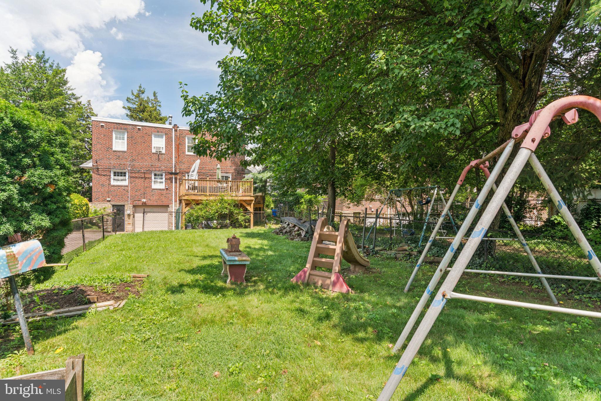 6768 Stenton Avenue Philadelphia, PA 19119 - Photo 67 of 76 a view of a house with a backyard and a slide
