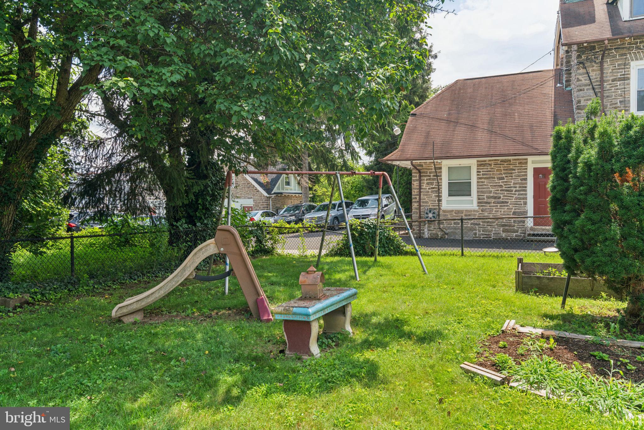 6768 Stenton Avenue Philadelphia, PA 19119 - Photo 68 of 76 a view of a house with a backyard and a slide