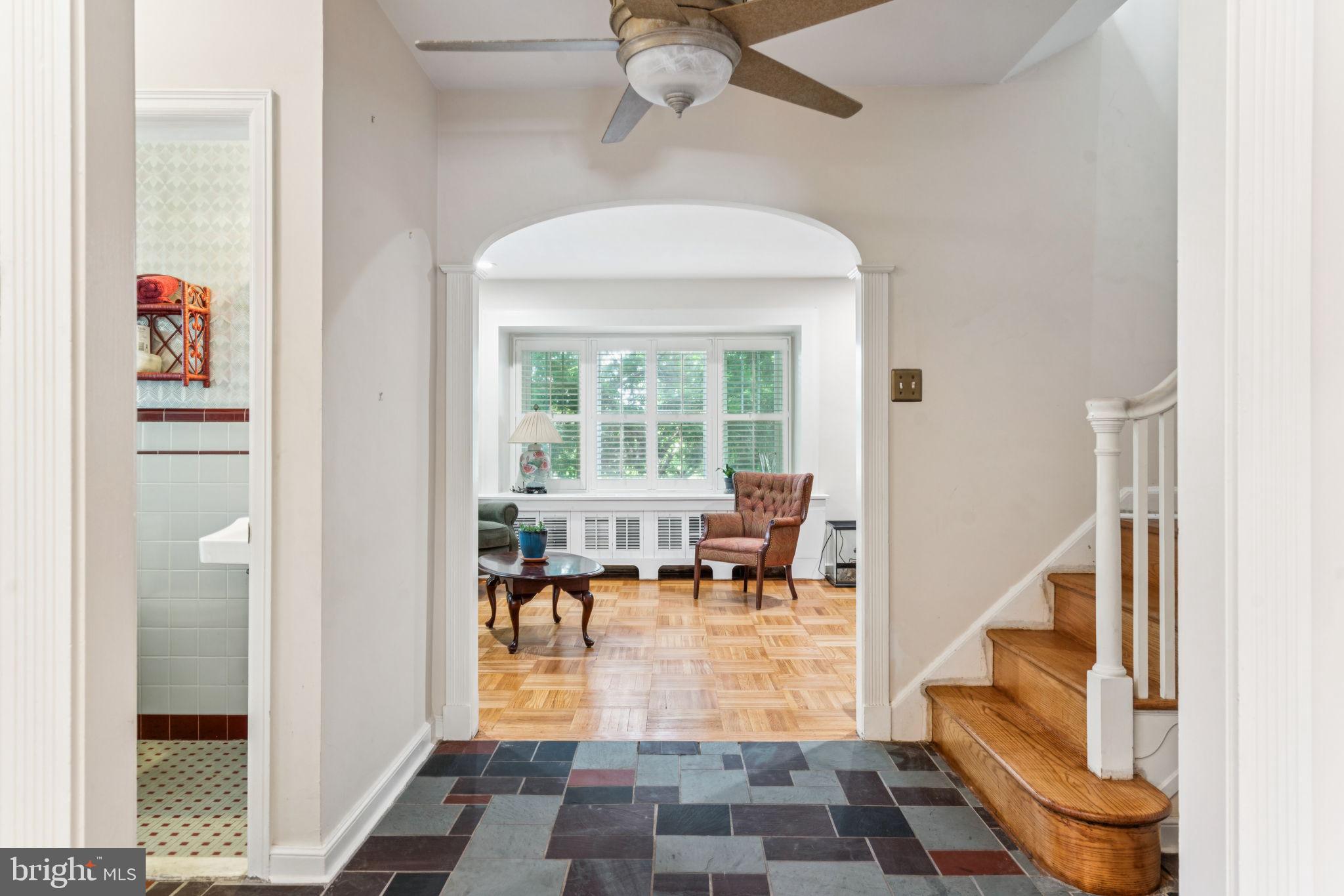 6768 Stenton Avenue Philadelphia, PA 19119 - Photo 8 of 76 a living room with furniture and a floor to ceiling window