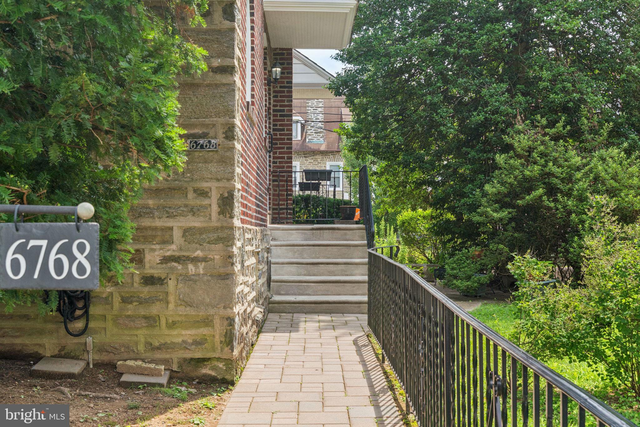6768 Stenton Avenue Philadelphia, PA 19119 - Photo 9 of 76 a view of a pathway both side of building