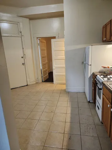 a kitchen with a stove and a refrigerator