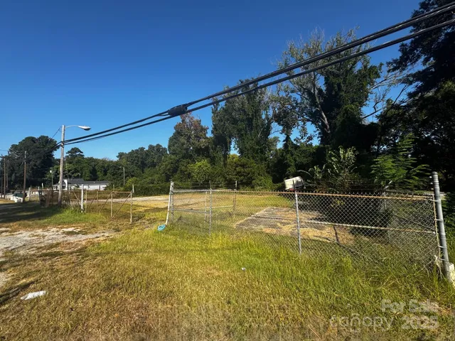a view of a swimming pool with a yard