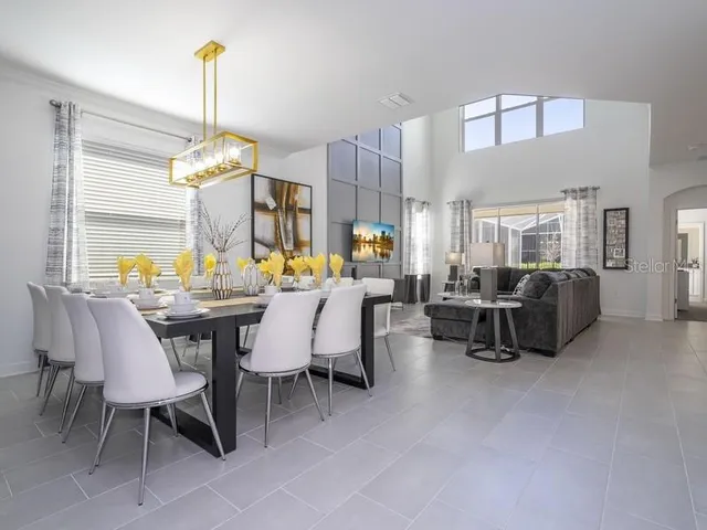 a view of a dining room with furniture and window
