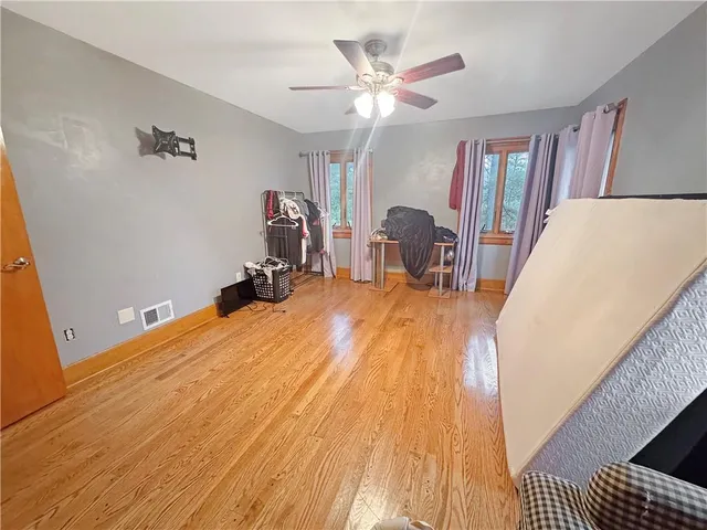 a bathroom with a sink mirror vanity and toilet