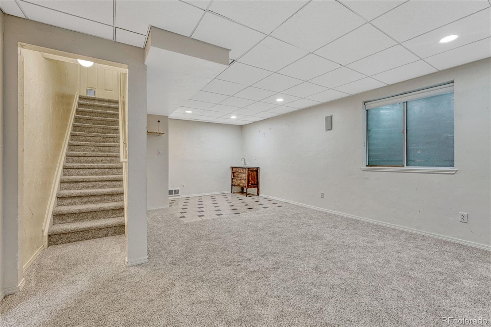 4927 Tarcoola Lane Highlands Ranch, CO 80130 - Photo 21 of 30 a view of a livingroom with stairs