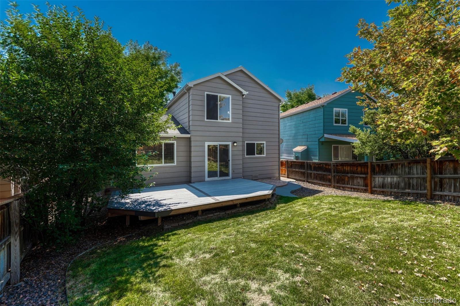 4927 Tarcoola Lane Highlands Ranch, CO 80130 - Photo 26 of 30 a view of a house with a yard