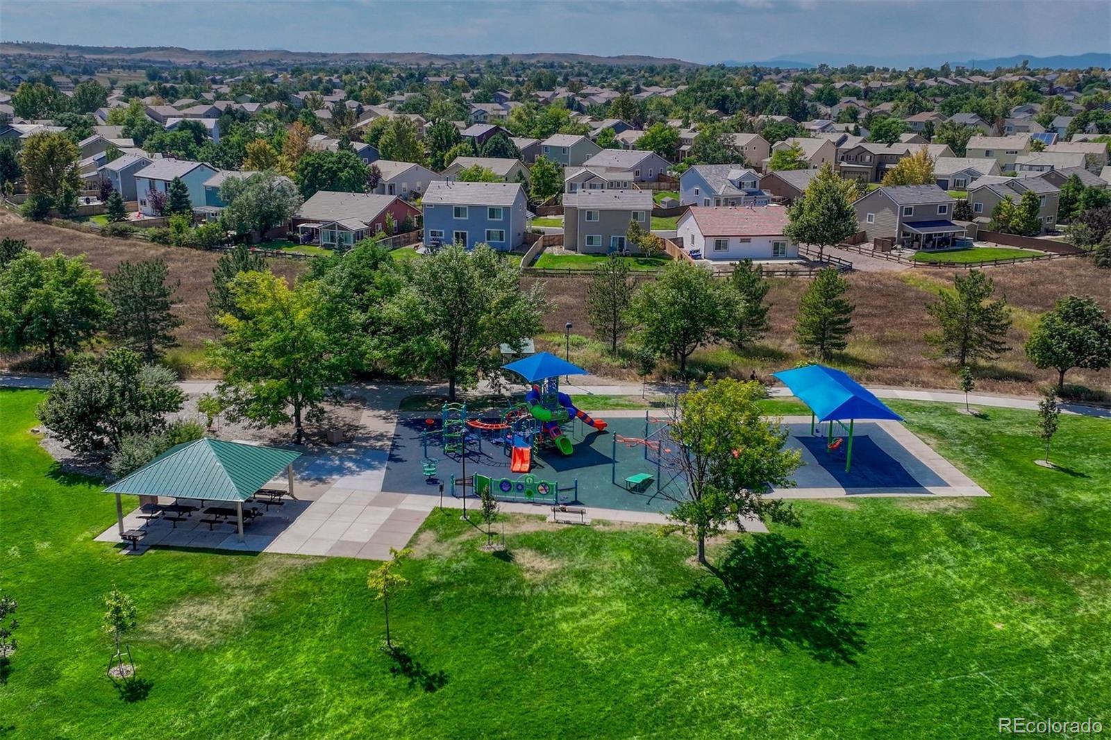 4927 Tarcoola Lane Highlands Ranch, CO 80130 - Photo 29 of 30 an aerial view of residential house with outdoor space and swimming pool